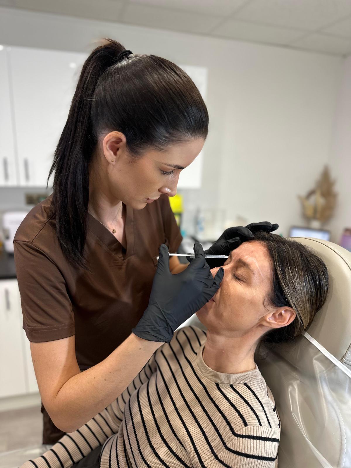 Jennifer carrying out an injectable skin booster treatment in clinic